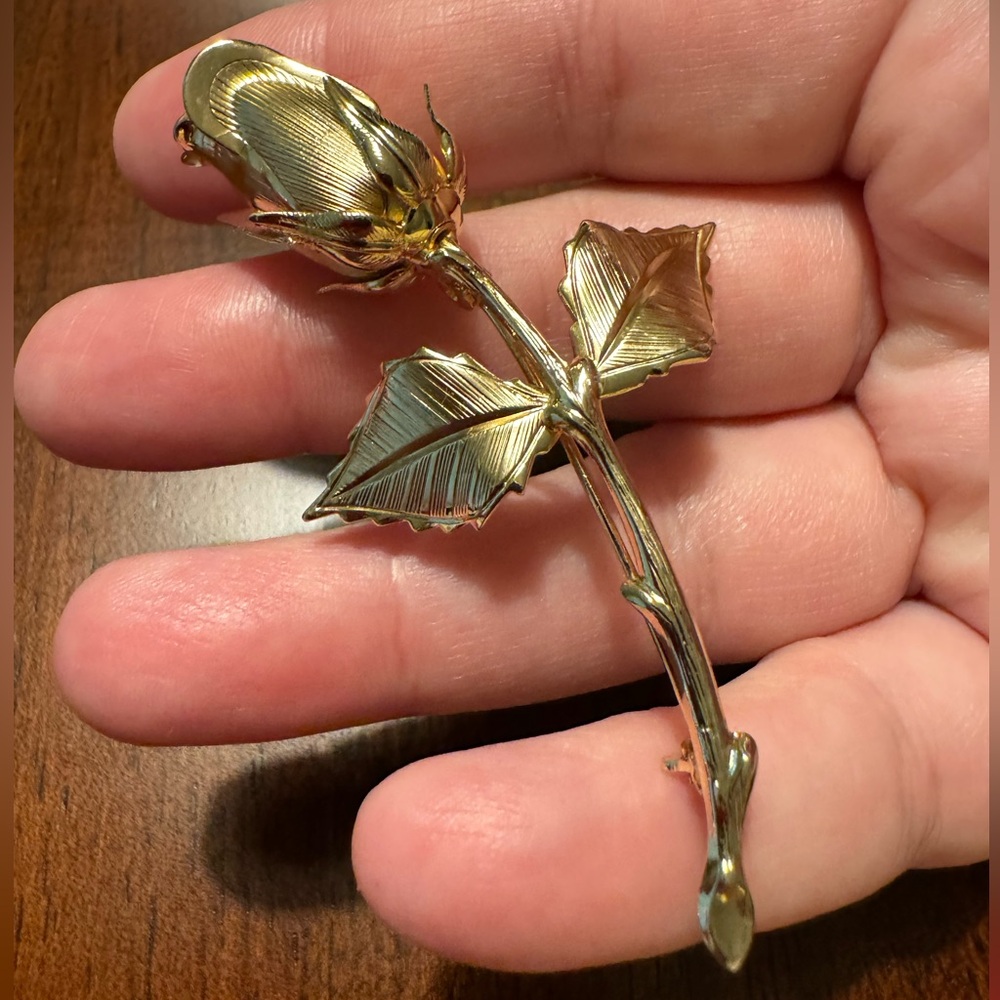 Rose brooch, EUC, gold toned. 3” long x 1 1/2” wide at leaves.